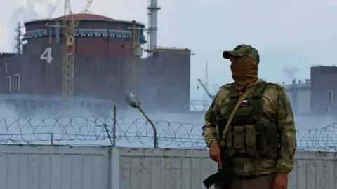 Reuters A Russian guard at Zaporizhzhia nuclear plant, 4 Aug 22