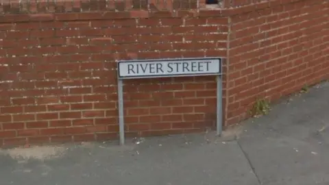 Google A street sign reading River Street