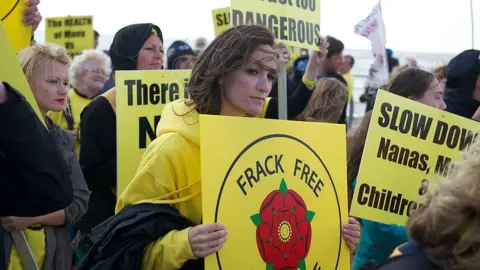 Getty Images Anti fracking protesters demonstrate peacefully on a march from Blackpool's South Pier to the North Pier