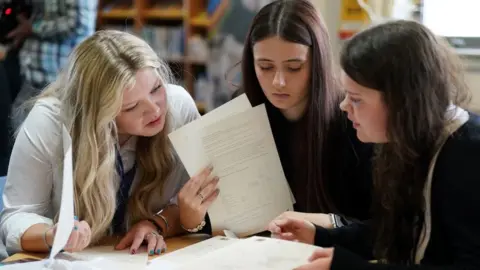 PA Media Pupils receiving exam results at Craigmount High School in Edinburgh