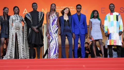 Getty Images Mati Diop (centre) and her Atlantics cast