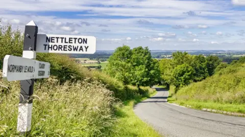 travellinglight/Getty Images Road sign