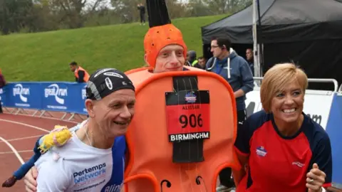 Blind Dave Heeley with a runner and Liz McColgan