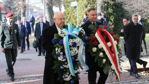 EPA The presidents of Israel and Poland - Reuven Rivlin and Andrzej Duda - with wreaths