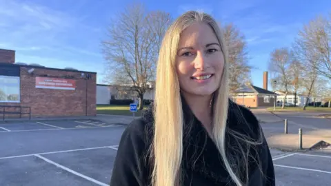 Nicola Haseler/BBC Louise Hampton outside the pool