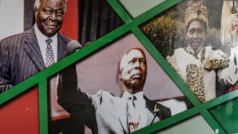 AFP Portraits of Kenya's former presidents: Mwai Kibaki (L), Daniel arap Moi (C) and Jomo Kenyatta (R) on a wall at the Kasarani Stadium in Nairobi, Kenya - 2018
