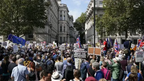 Getty Images Demonstrators protest the suspension of Parliament in Whitehall, central London