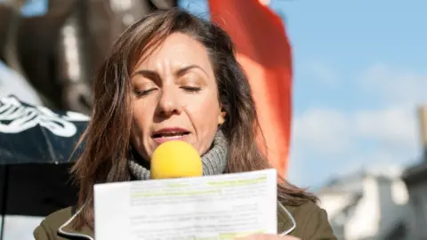 Getty Images Julia Bradbury addresses a crowd at speech