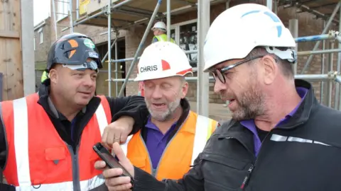 BBC Builder Jules Perryman, plaster Chris Frediani and presenter Nick Knowles