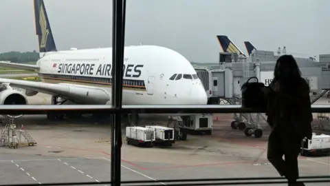 AFP A Singapore Airlines Airbus A380 plane is seen parked on the tarmac at Changi International Airport in Singapore on October 24, 2020