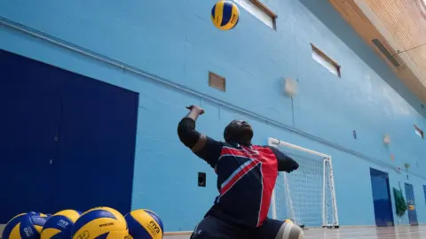 PA Lamin Manneh serving during a training session