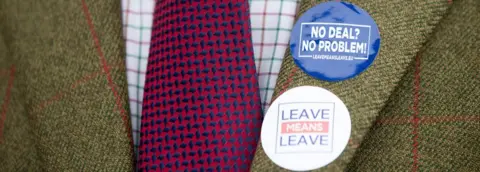 Getty Images Leave means leave badges on a jacket