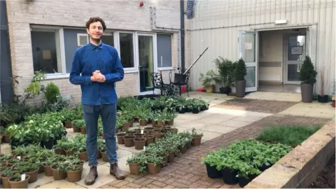 BBC Garden designer Tom Massey with the plants donated to Derriford Hospital in Plymouth