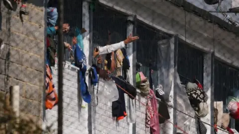 Reuters Prisoners are seen at windows inside La Modelo prison in Bogotá