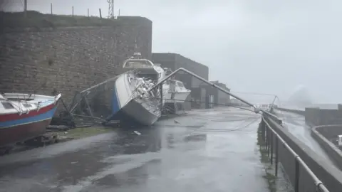 BBC Yacht blown over in Braye Harbour, Alderney
