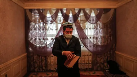 EPA Muslim Uyghur man in a mosque, Xinjiang region (file pic)