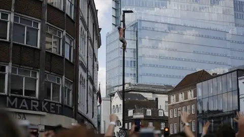 AFP/Getty Images Climber in Borough High Street