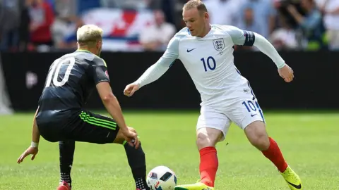 Getty Images Aaron Ramsey and Wayne Rooney