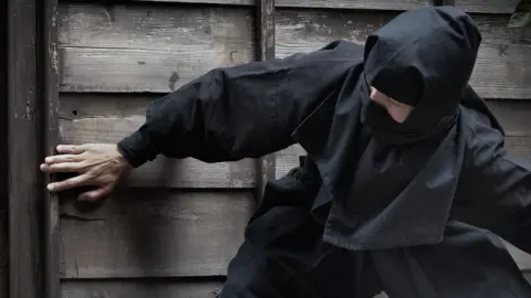 Getty Images The thief was wearing all black like a ninja (file photo)