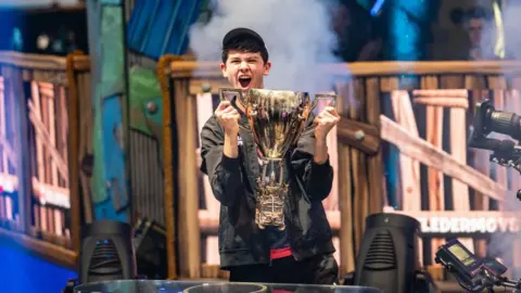 Getty Images Kyle "Bugha" Giersdorf celebrates winning Fortnite World Cup at Arthur Ashe Stadium on July 28, 2019 in the Flushing neighborhood of the Queens borough of New York City