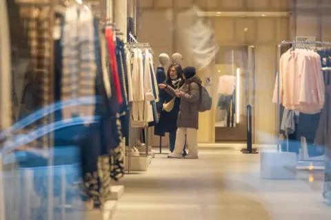 Getty Images Shoppers in New York