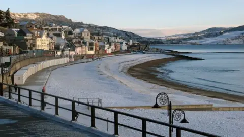 M Etherington Lyme Regis beach in the winter