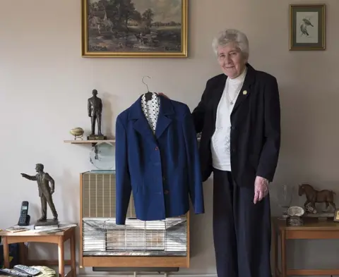 Julian Germain / PhotoEast Pat Godbold with the blue suit she wore at Wembley