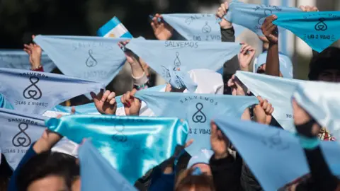 Getty Images Blue neckerchieves became the emblem of the anti-abortion campaign