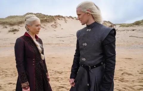 HBO Emma D'Arcy and Matt Smith pictured in costume on a beach