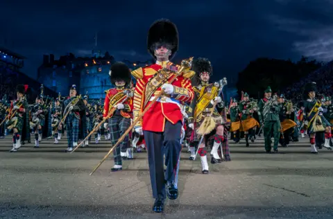 Jane Barlow/PA Media The Massed Pipes and Drums perform on the Esplanade of Edinburgh Castle at this year's Royal Edinburgh Military Tattoo. August 3, 2023.