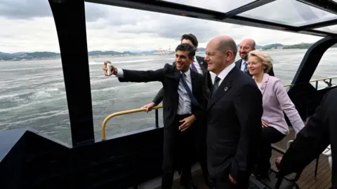 Reuters Rishi Sunak taking a selfie on a boat with other world leaders at the G7