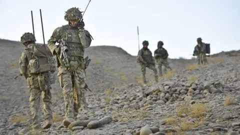 PA Media Soldiers from the 1st Battalion Royal Regiment Fusiliers conduct a dawn foot patrol in the Nahr-e Saraj district, Helmand Province, Afghanistan