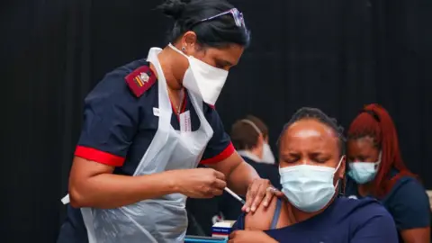 Getty Images Health workers during Premier Makhura visit to Netcare Milpark Vaccination Site on March 11, 2021