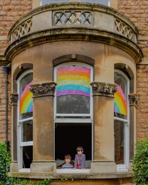 Tom Skipp Lawton and Teddy at the window