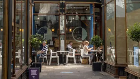 Getty Images People sat at Cafe