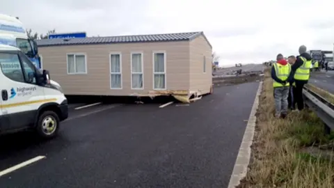 PA Media The scene of the crash