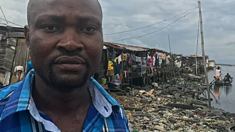 BBC Seun pictured near his home in the slums of Lagos, Nigeria