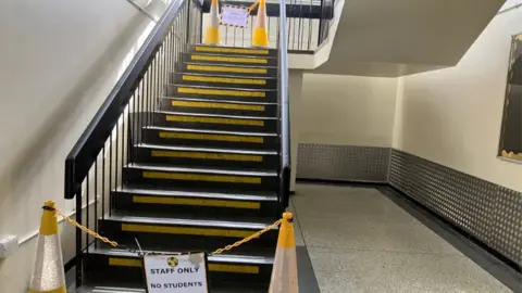 A staircase in the school blocked off