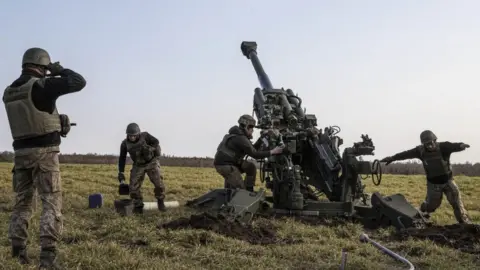 Getty Images Ukrainian artillery troops firing near Kherson