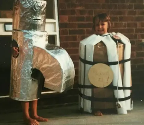 Lara Slater Youngsters dressed up as a tap and a hot water tank