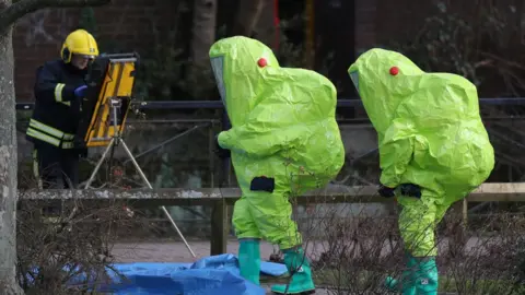 PA Investigators in hazmat suits walk near where Sergei and Yulia were found