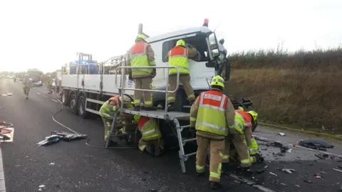Bedfordshire Fire and Rescue Service Firefighters at scene of an accident