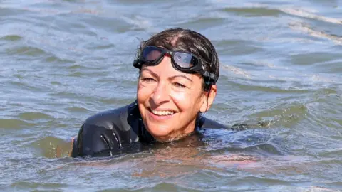 Getty Images Mayor of Paris Anne Hidalgo swims in the Seine