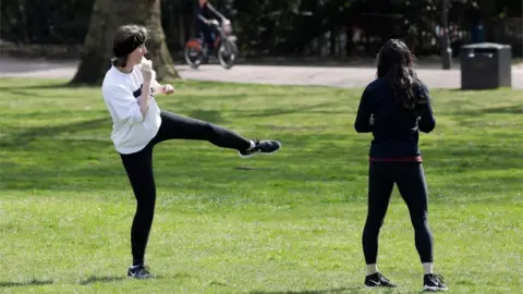 Getty Images Women working out in a field