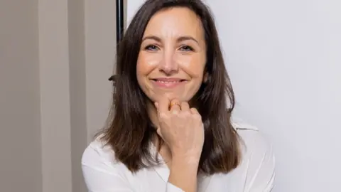 James Greenoff-Cairns Janine Marsh smiles to the camera