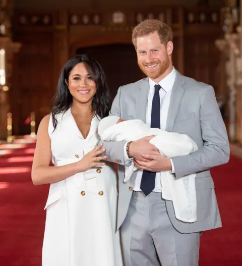 PA The Duke and Duchess of Sussex and their son