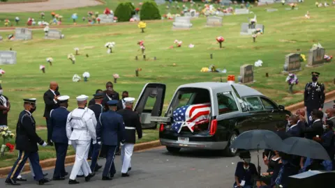 Reuters the hearse carrying Lewis's body