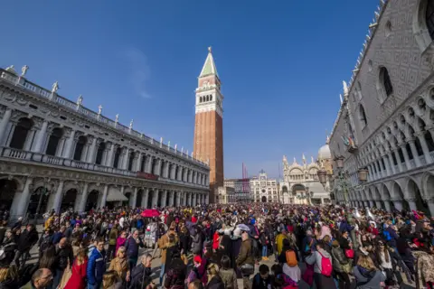 Getty Images Thousands of people are gathering at San Marco Square, Piazza San Marco to celebrate the Venetian Carnival, 3 March 2019