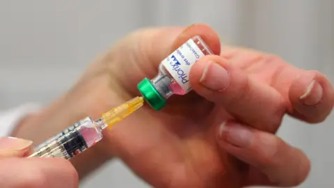 Getty Images A generic photograph of a vaccine being drawn from a vial into a needle