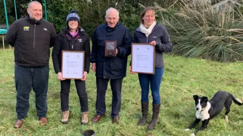 Jane Bown Tom with plaque